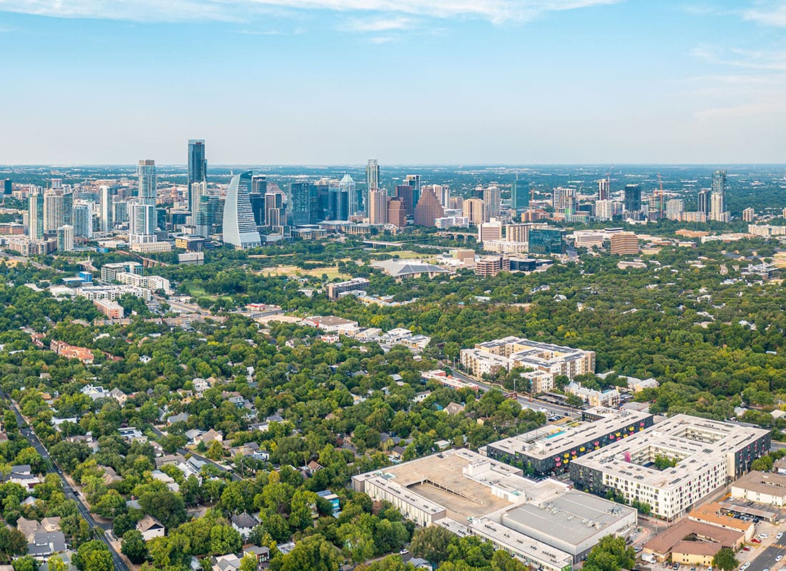 Austin, TX - Aerial View of Austin, TX With Many Trees and Buildings